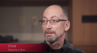screen shot of man talking in video