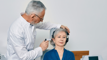 Person in a doctor's office having their hearing checked